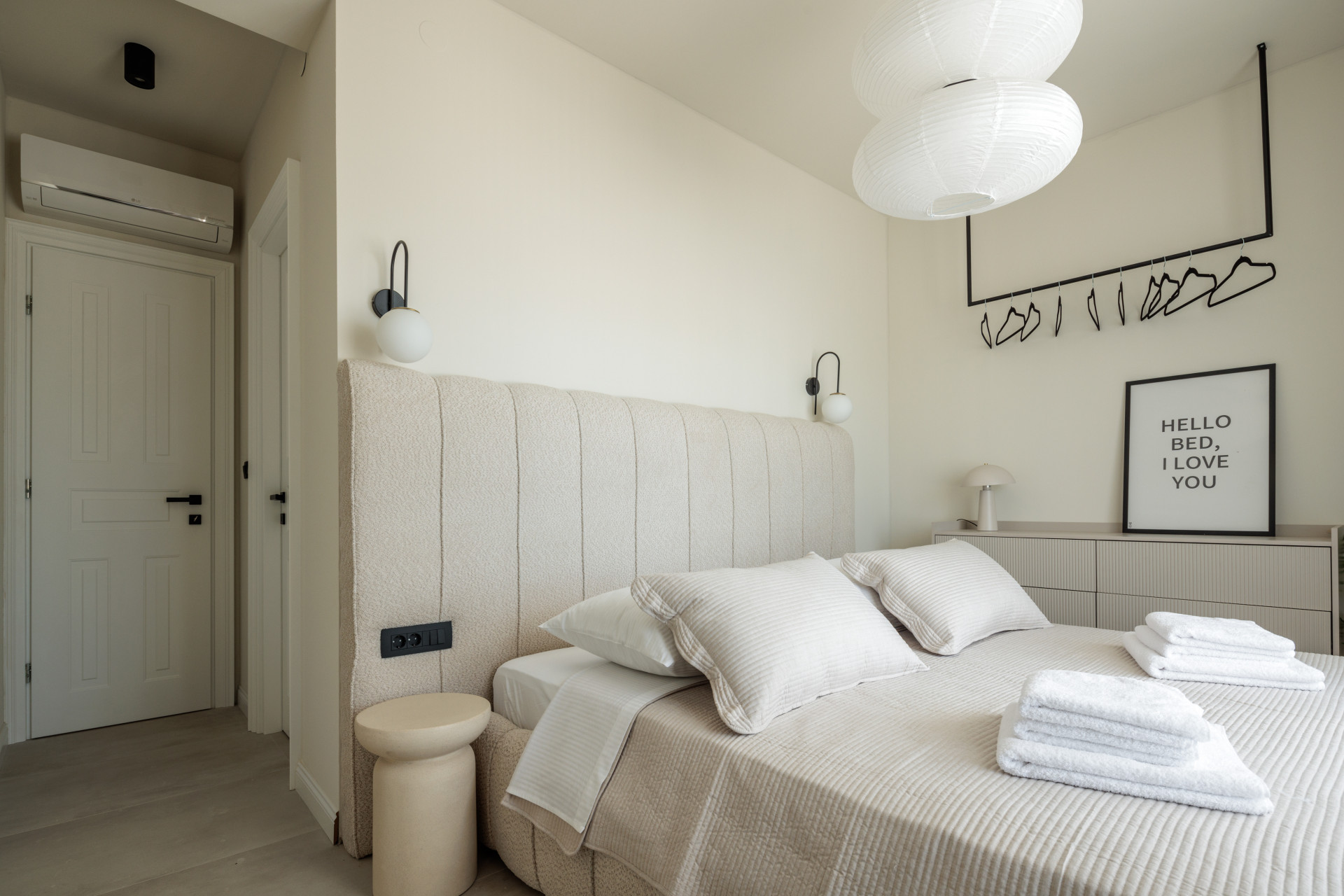 Villa Casa NoTa bedroom with upholstered headboard